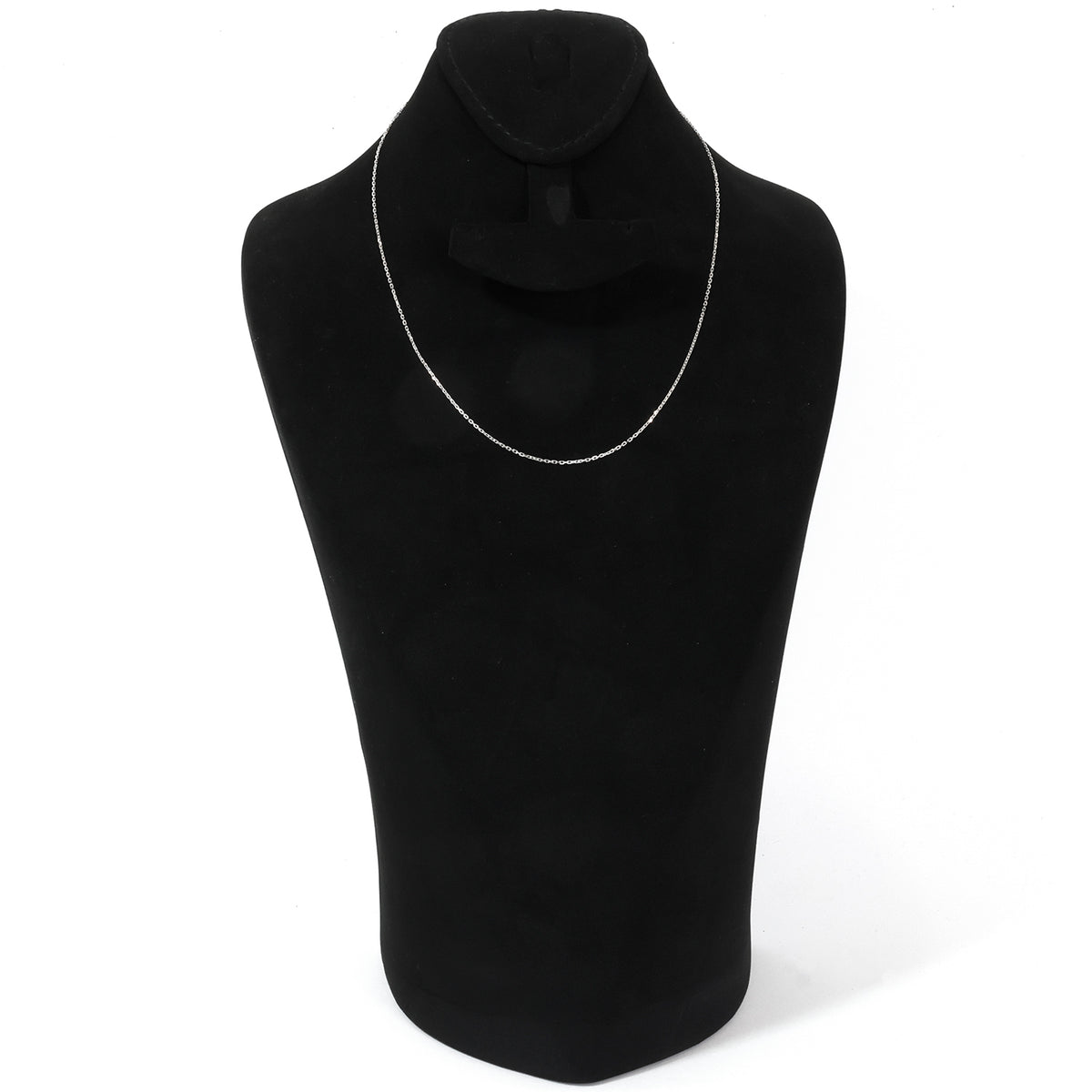 Black scarf with silver chain on a black mannequin against a white background