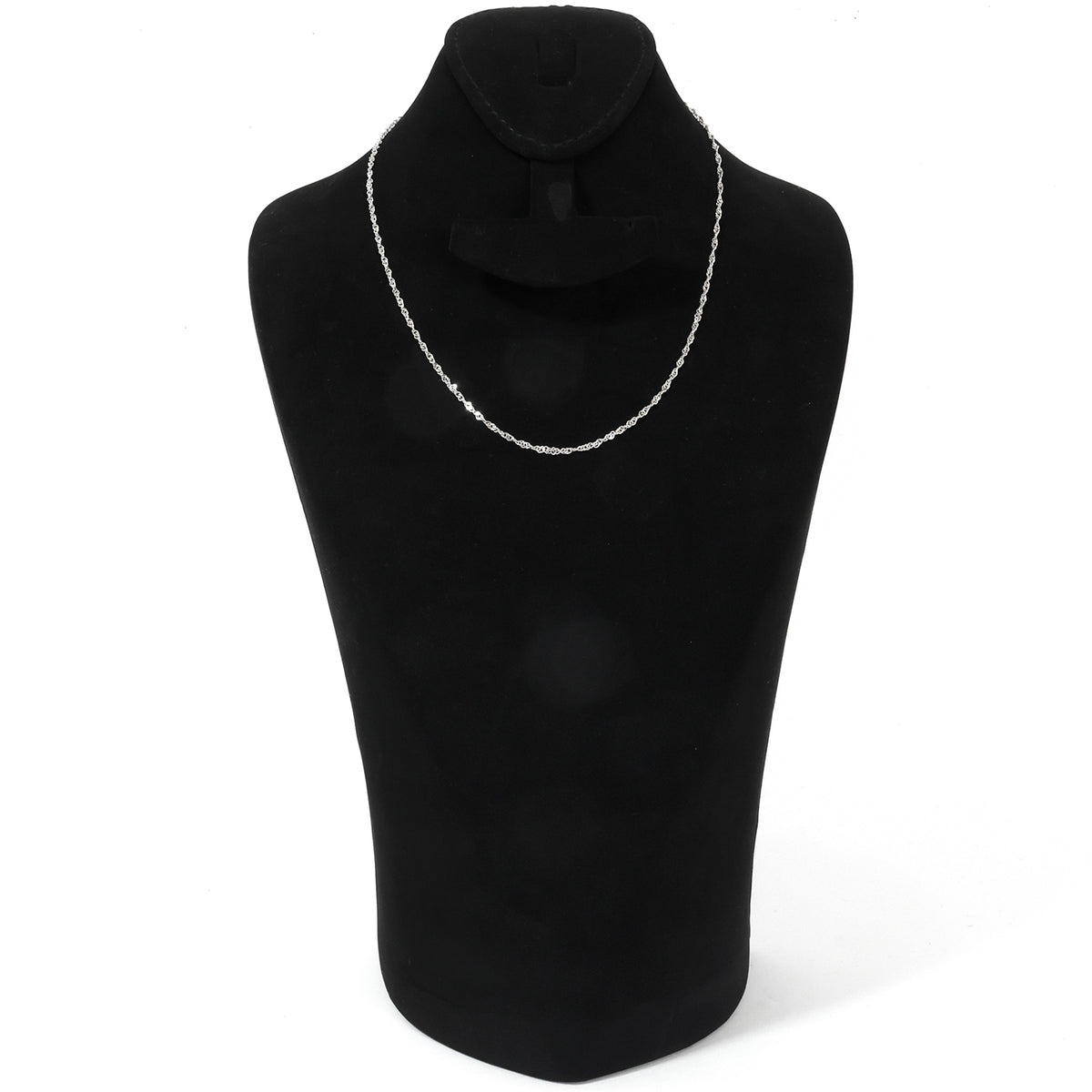 Gold necklace with Arabic script on a black mannequin bust against a white background