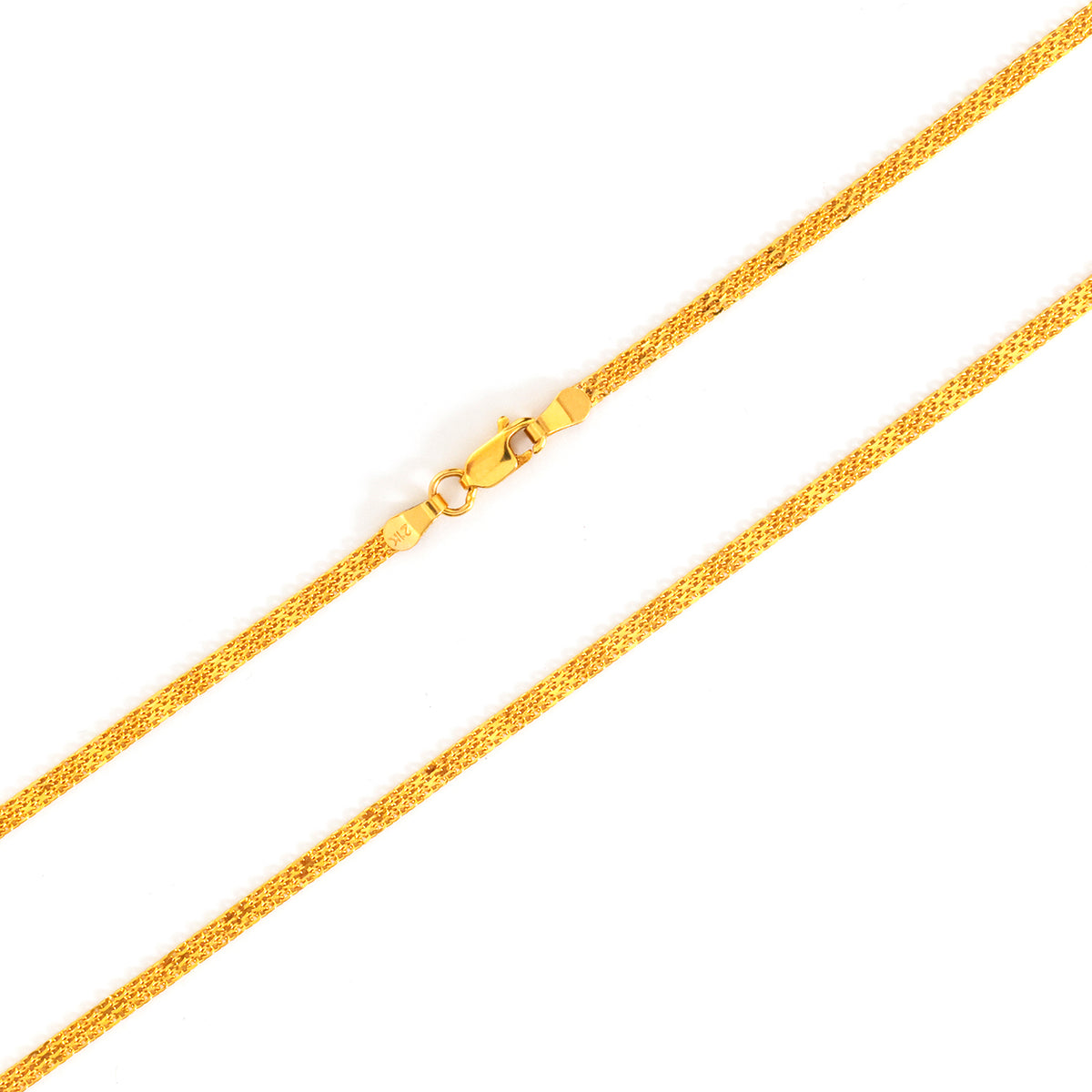 Gold chain necklace on a white background