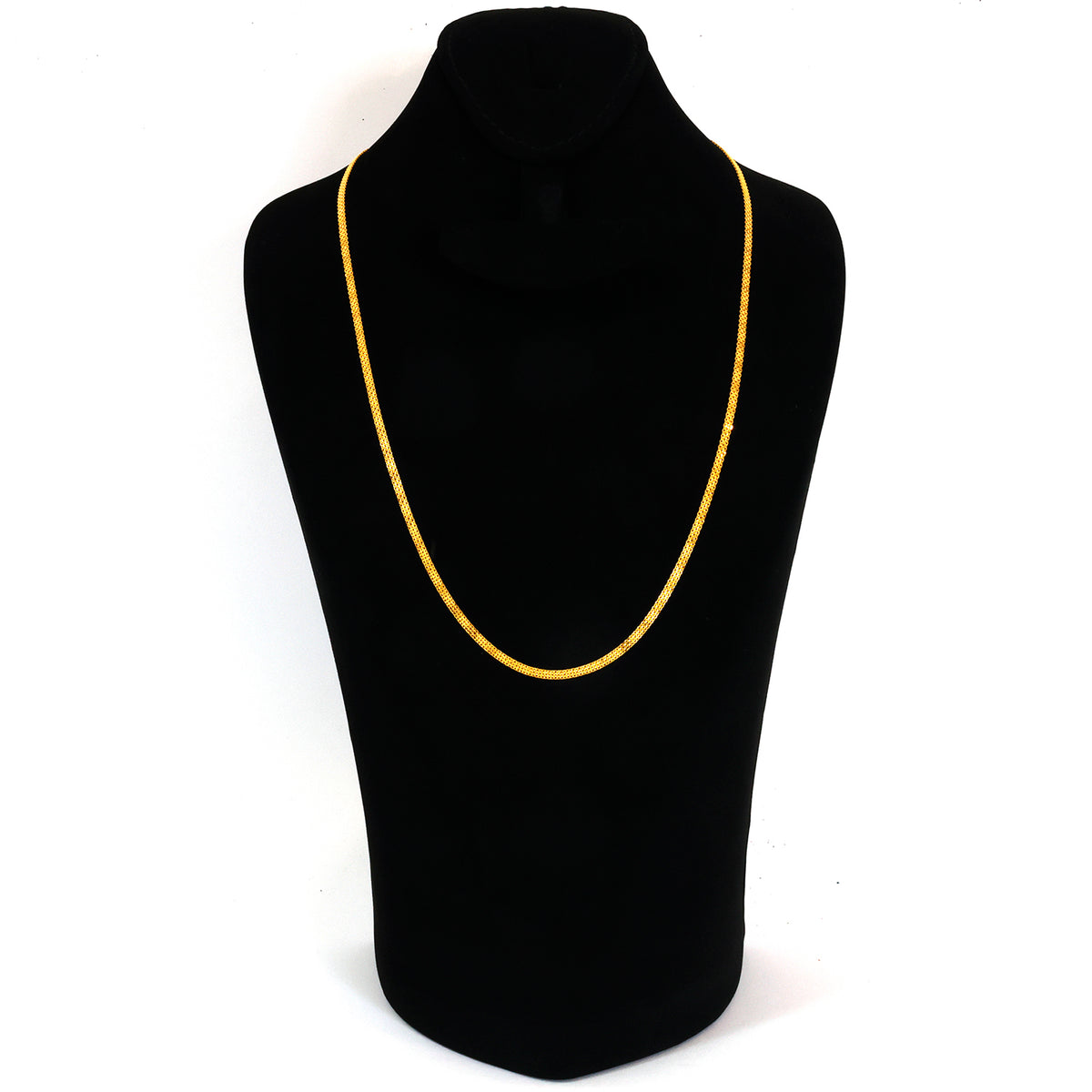 Black mannequin with a yellow necklace on a white background