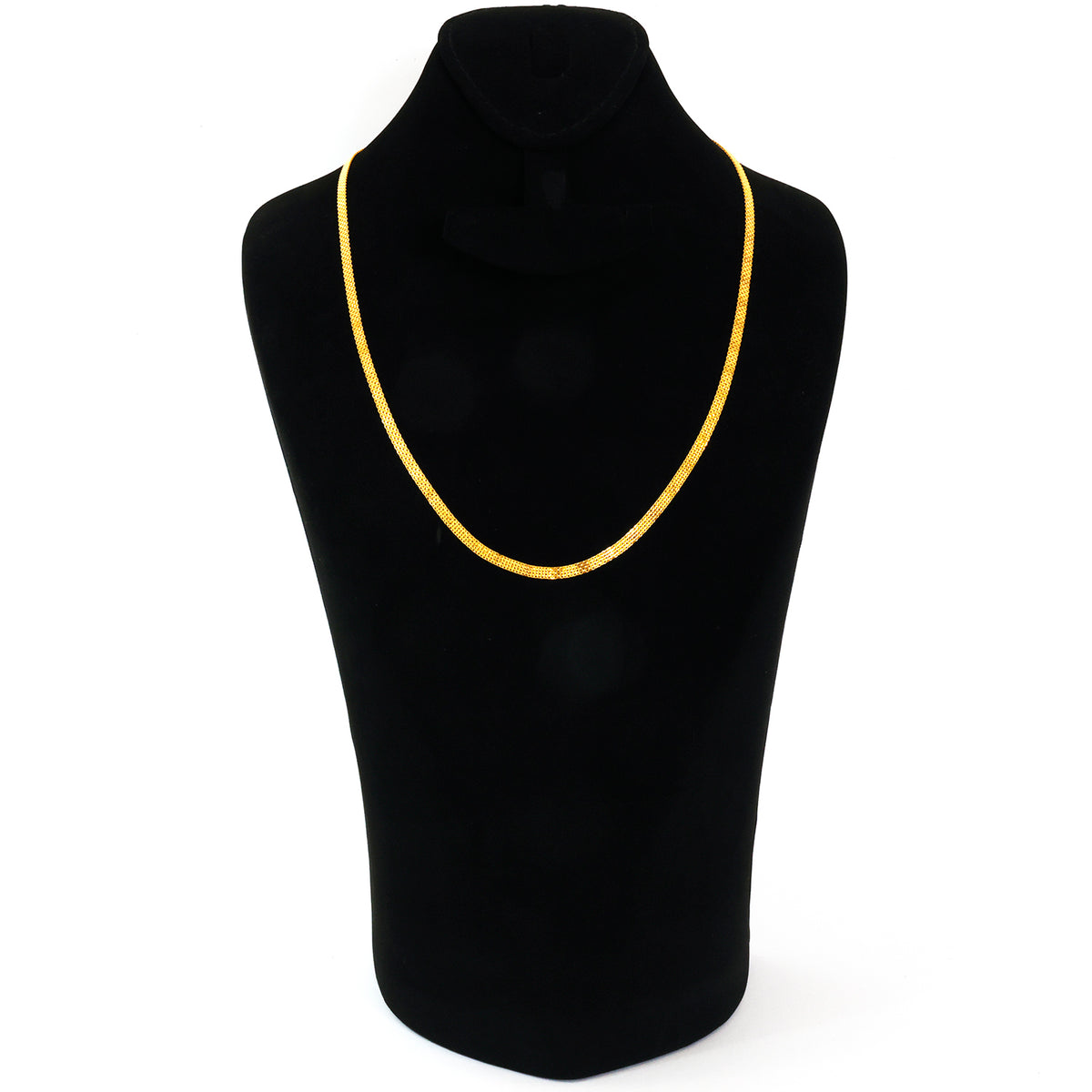 Gold necklace on a black mannequin with a white background