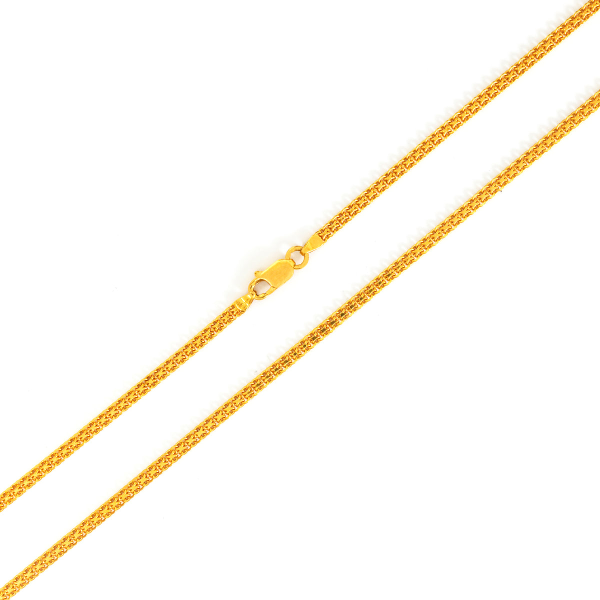 Gold chain necklace on a white background