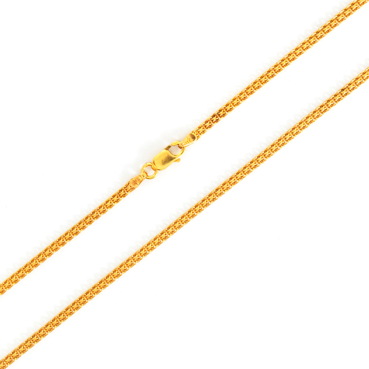 Gold chain necklace on a white background