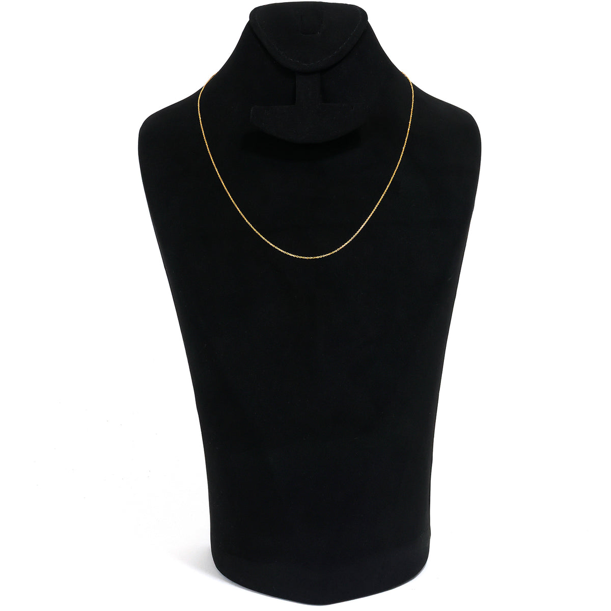 Black sweater on a mannequin with a gold necklace against a white background