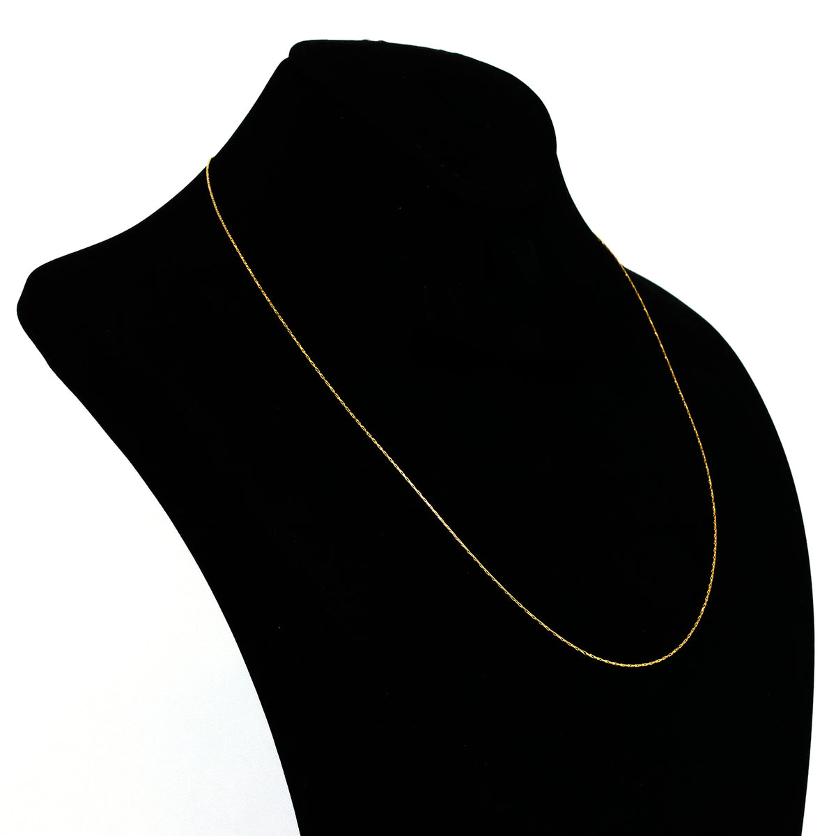 Gold necklace on a black mannequin with a white background