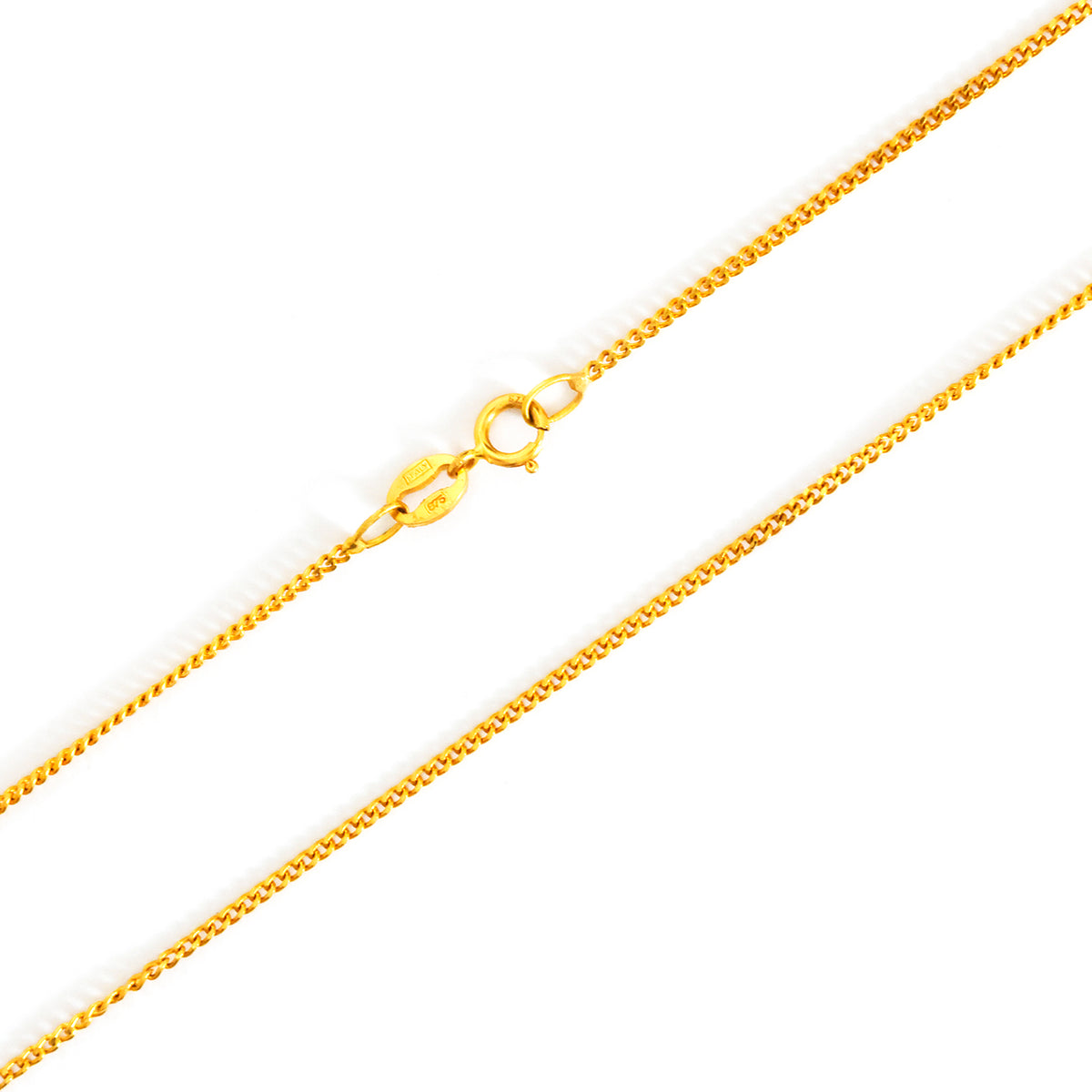 Gold chain necklace on a white background