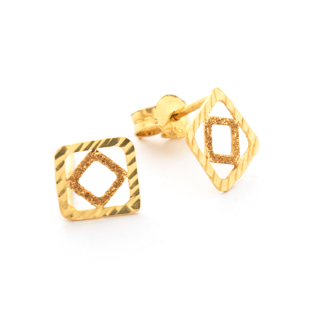 Gold earrings with geometric design on a white background