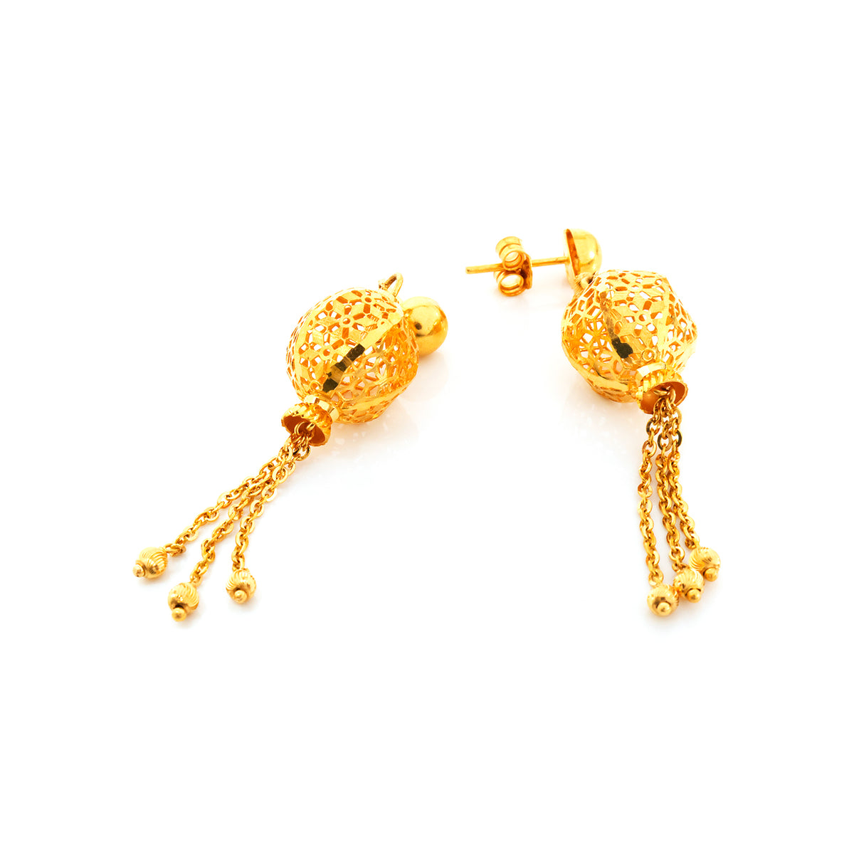 Gold earrings with intricate designs on a white background