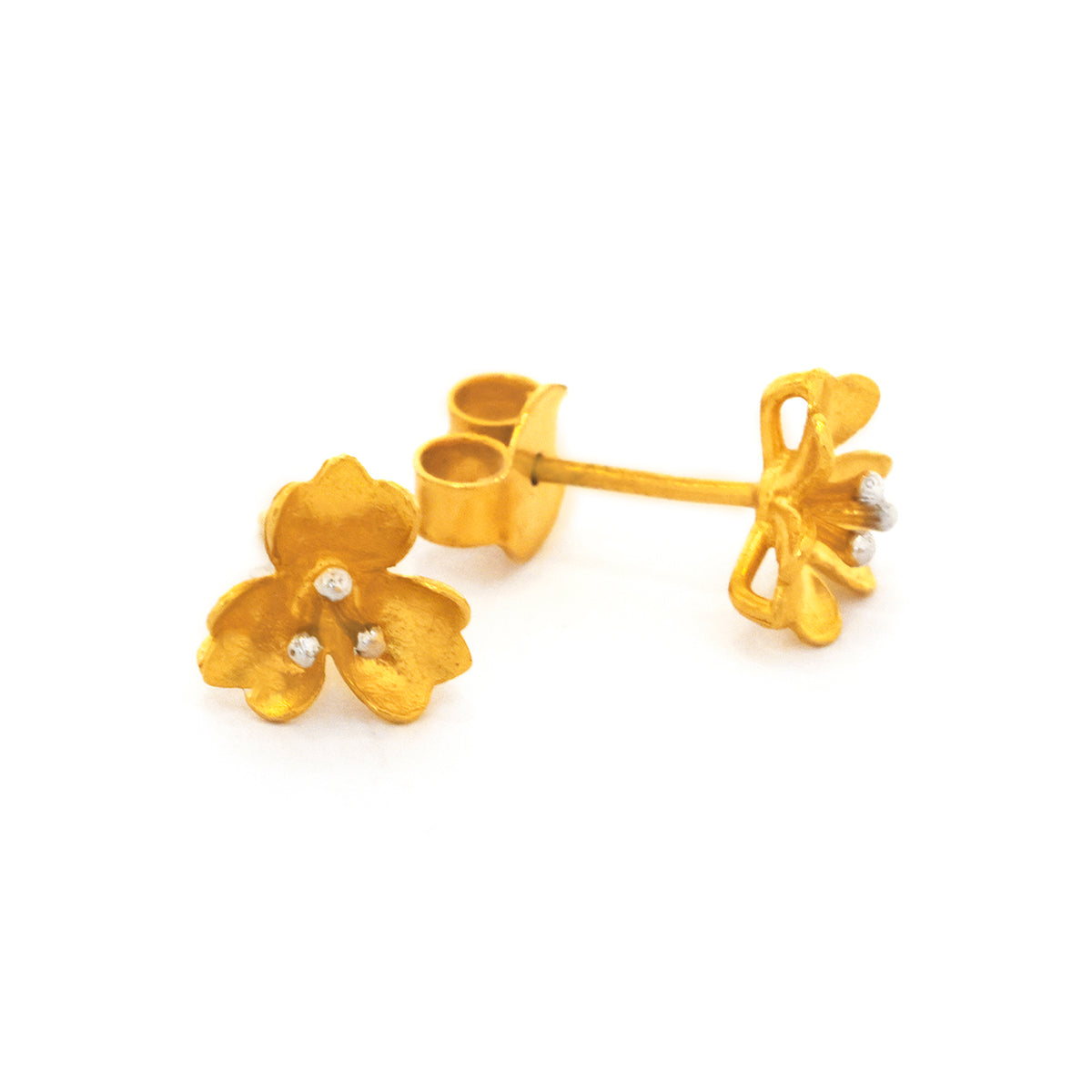 Gold flower-shaped earrings on a white background