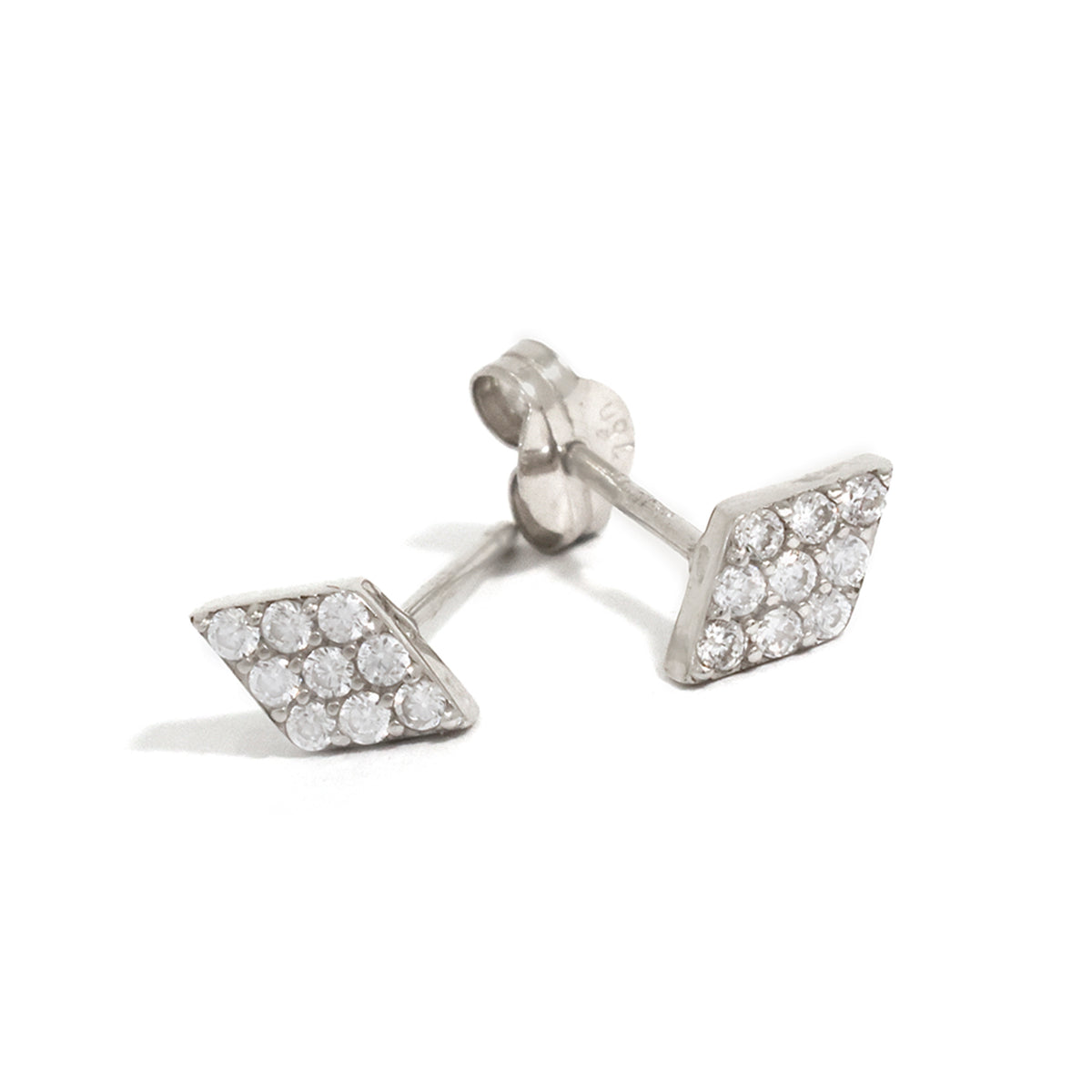Pair of diamond-studded silver earrings on a white background