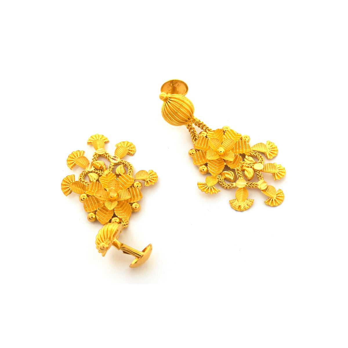 Pair of gold earrings on a white background