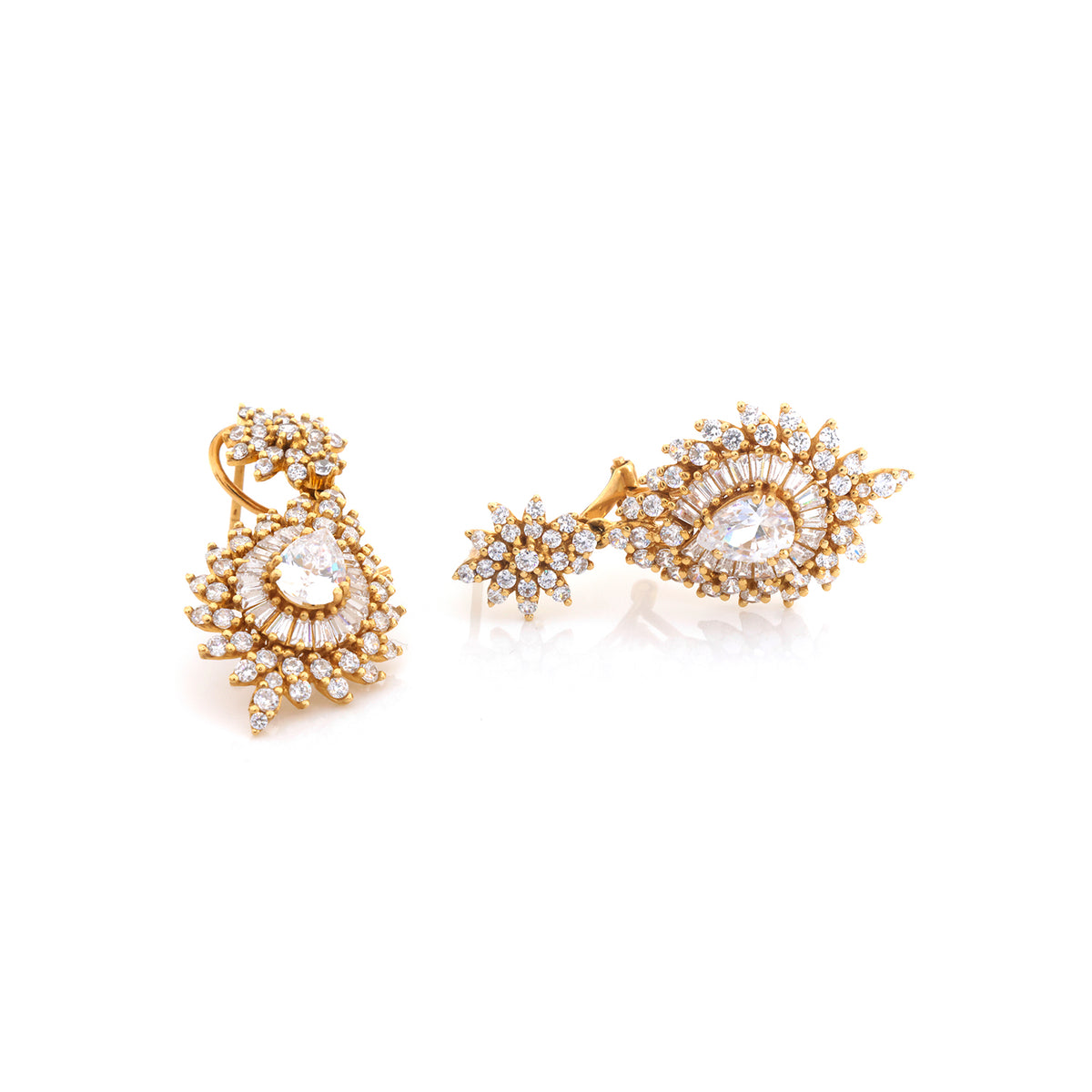A pair of gold-toned statement earrings with clear gemstones, photographed on a clean white background.