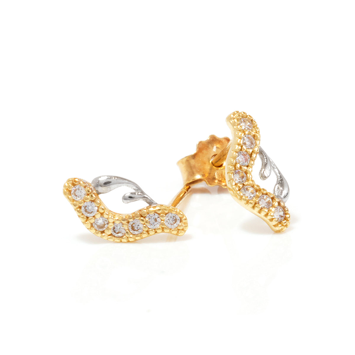 Gold and silver earring with clear stones on a white background