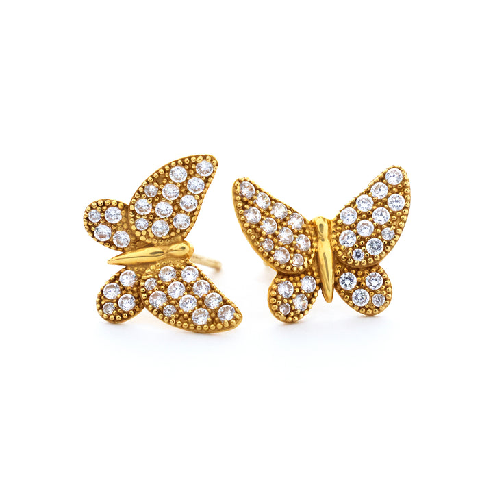 Gold butterfly earrings with diamond accents on a white background