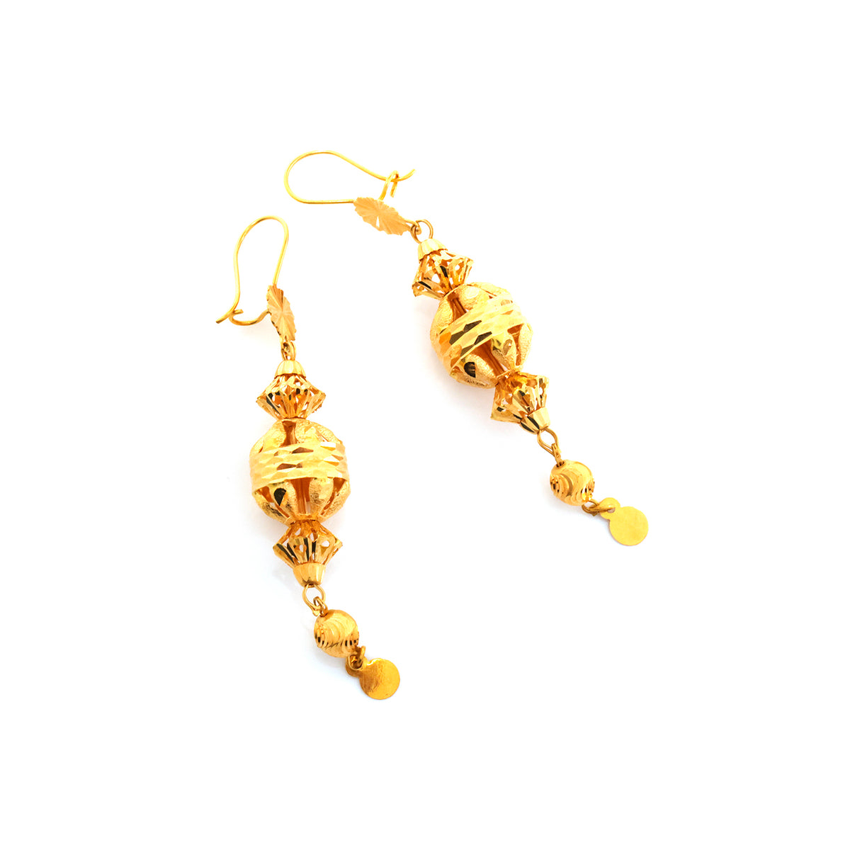 Pair of gold earrings on a white background