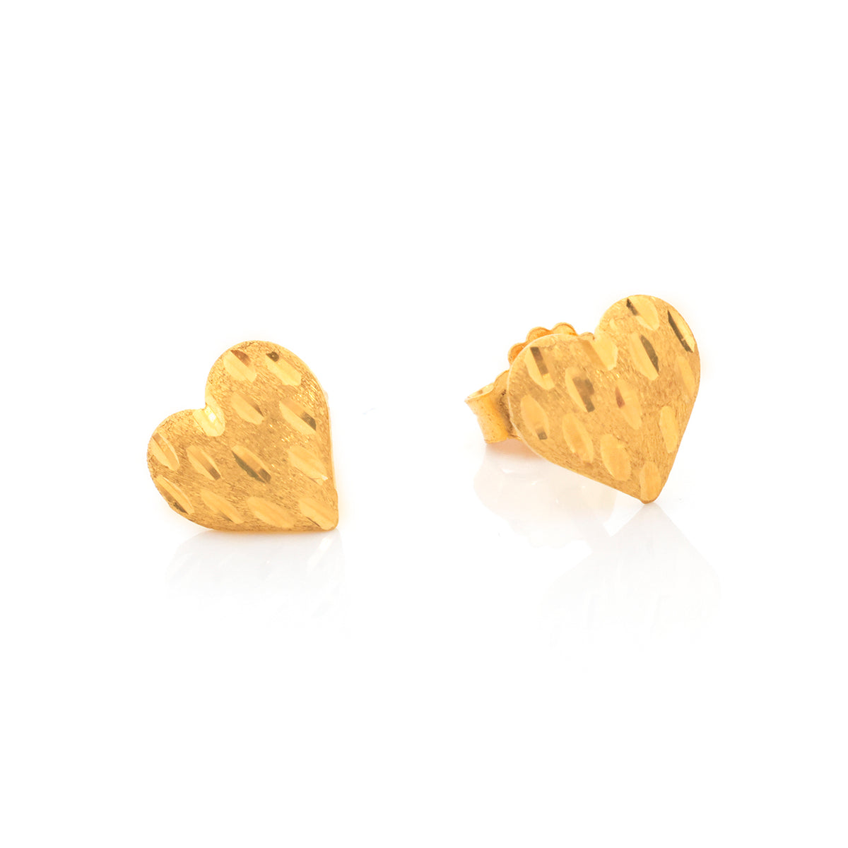 A pair of textured gold heart stud earrings on a clean white background.