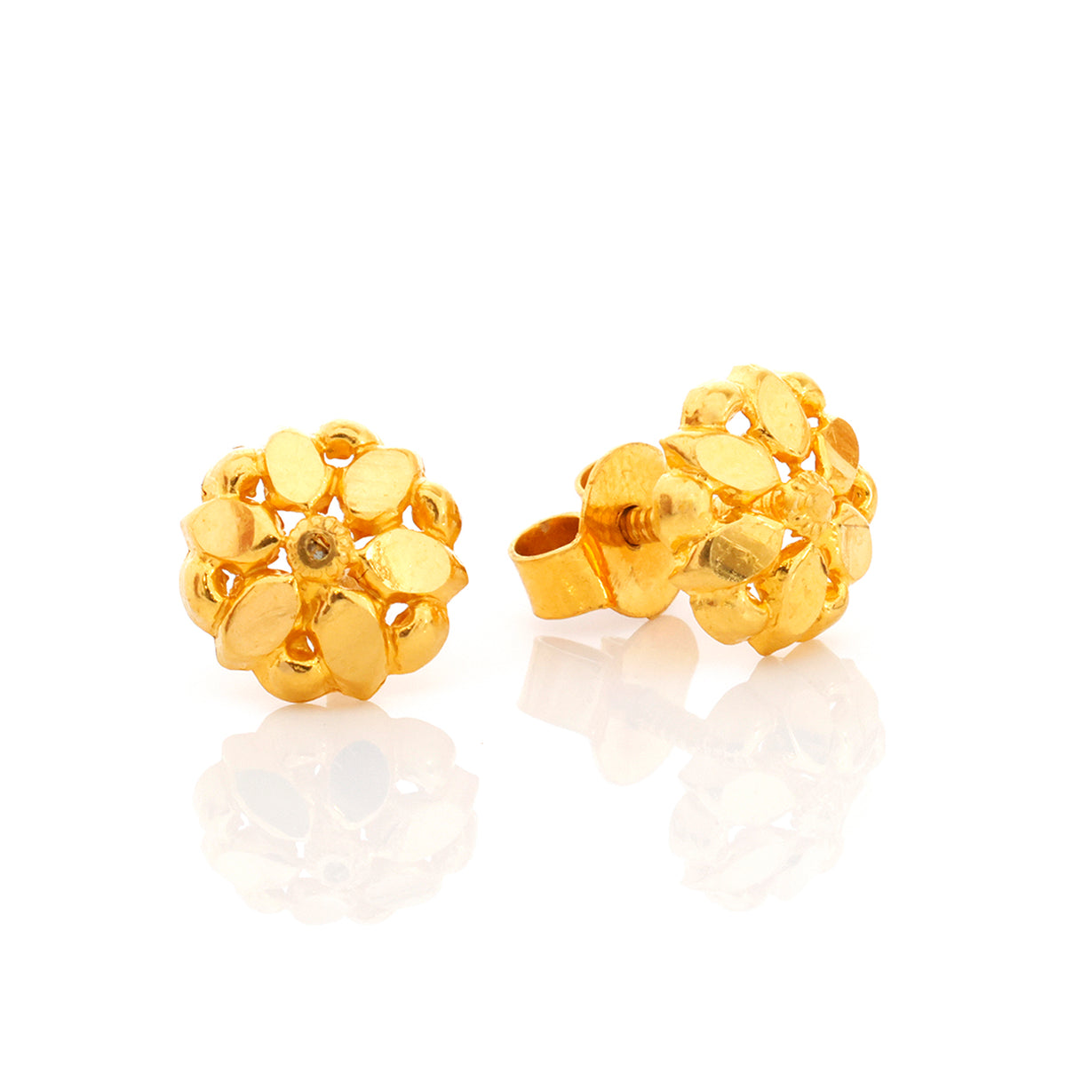 Pair of gold floral earrings on a white background