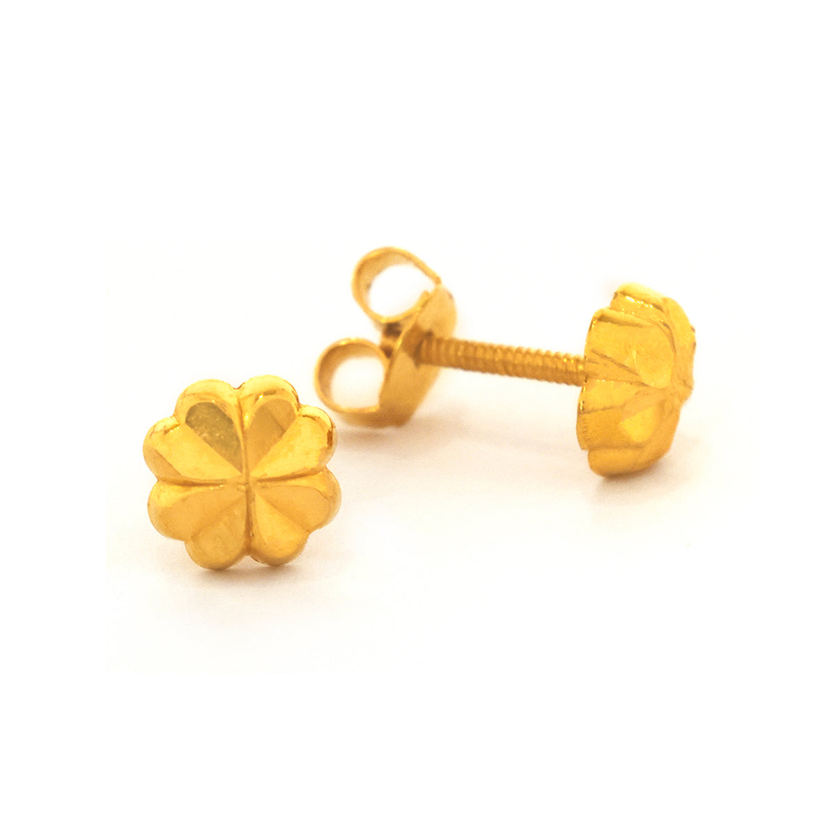 Gold four-leaf clover earrings on a white background