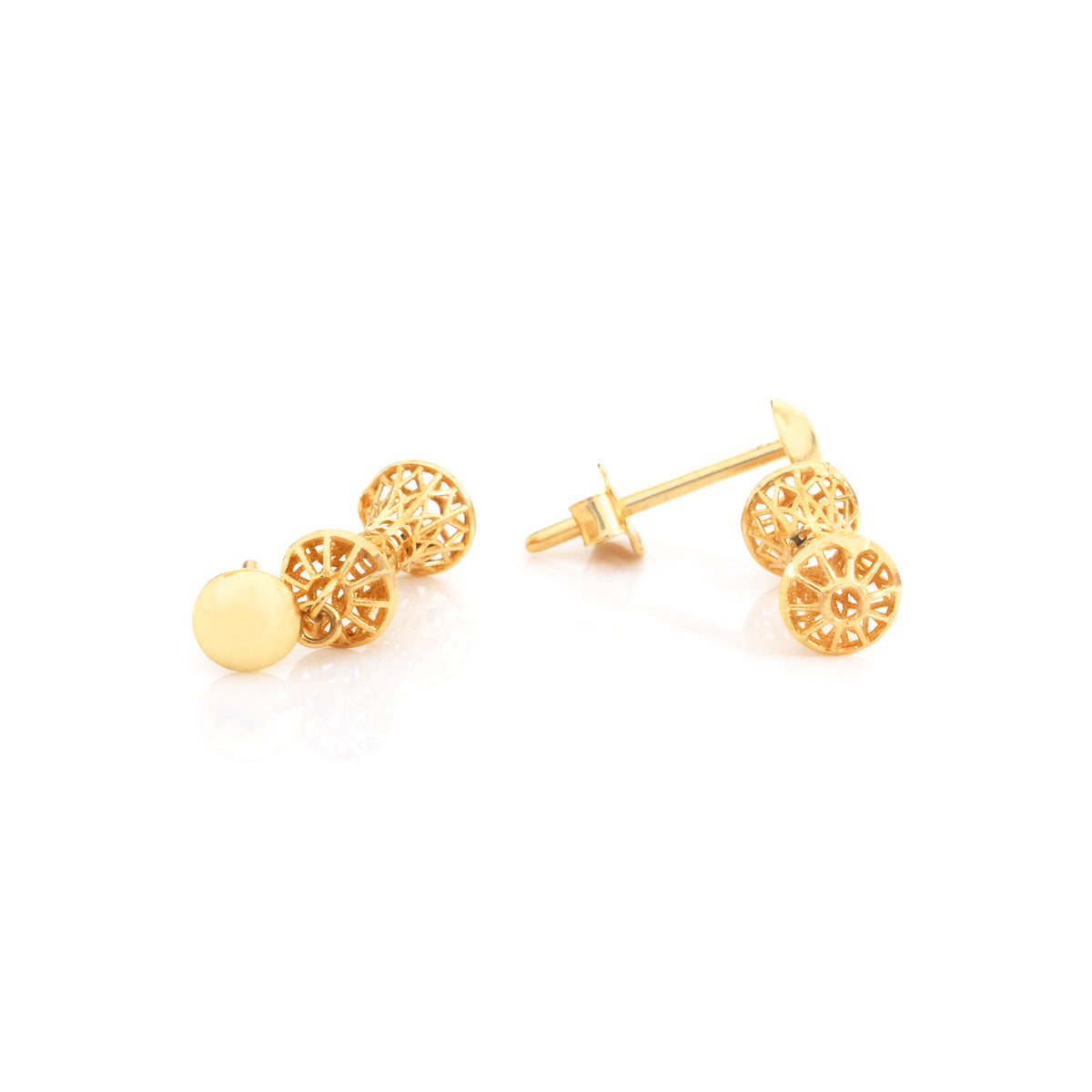A pair of gold stud earrings on a clean white background, showing both a flat round gold ball stud and a filigree circular stud with a post and butterfly back.
