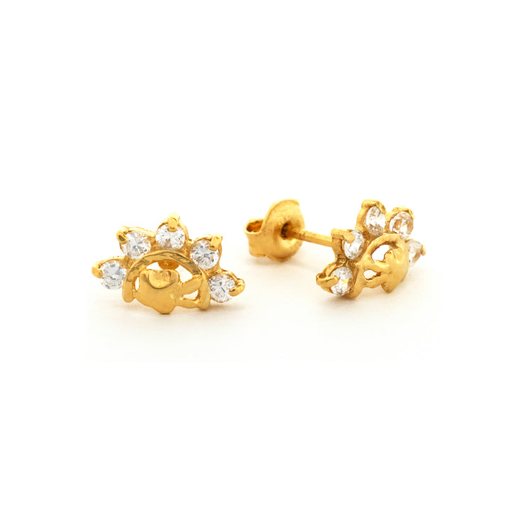 ذهب أقراط مع clear gemstones on white background