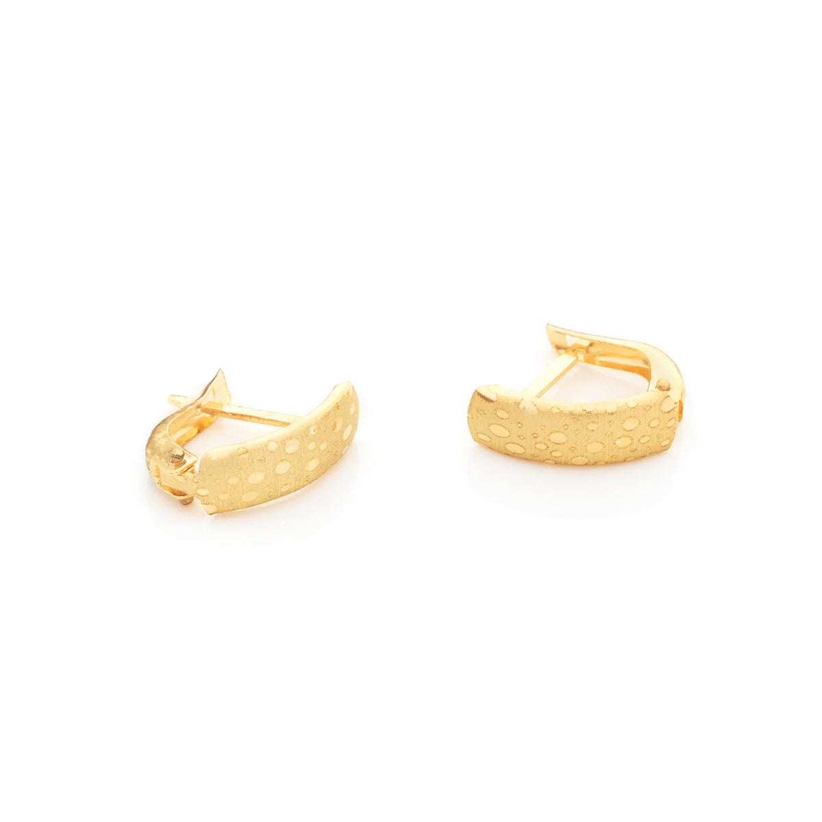 A pair of textured gold huggie hoop earrings on a clean white background.