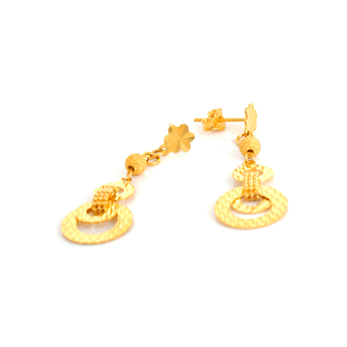 Gold earrings on a white background