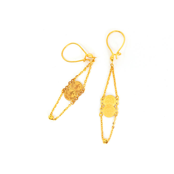 Pair of gold earrings on a white background