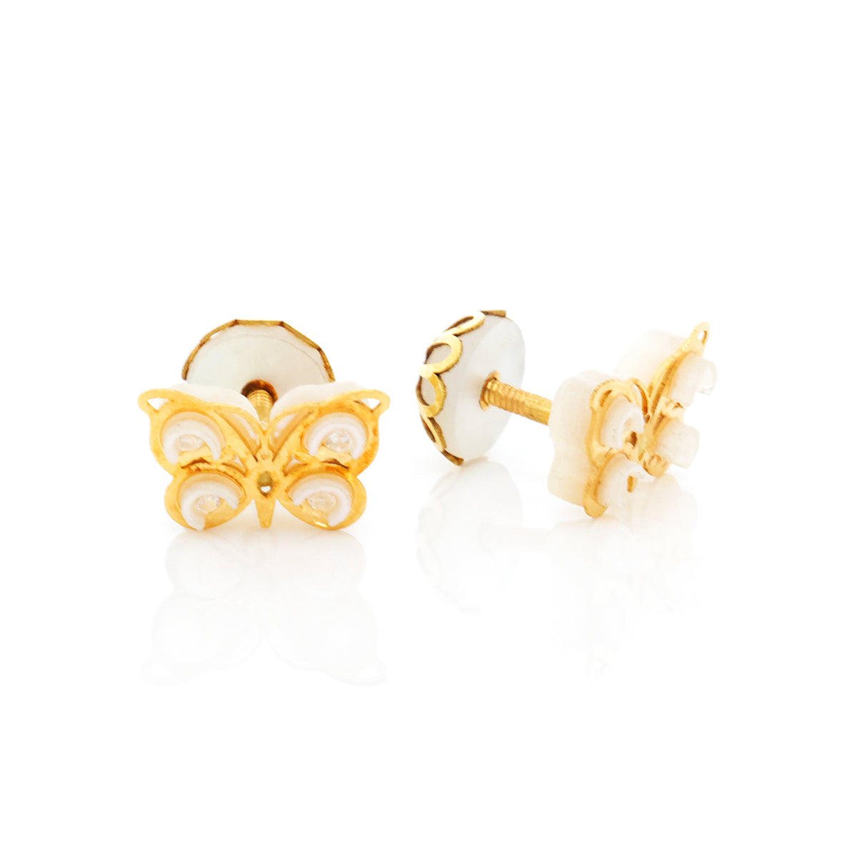 Butterfly-shaped gold and white earrings on a white background