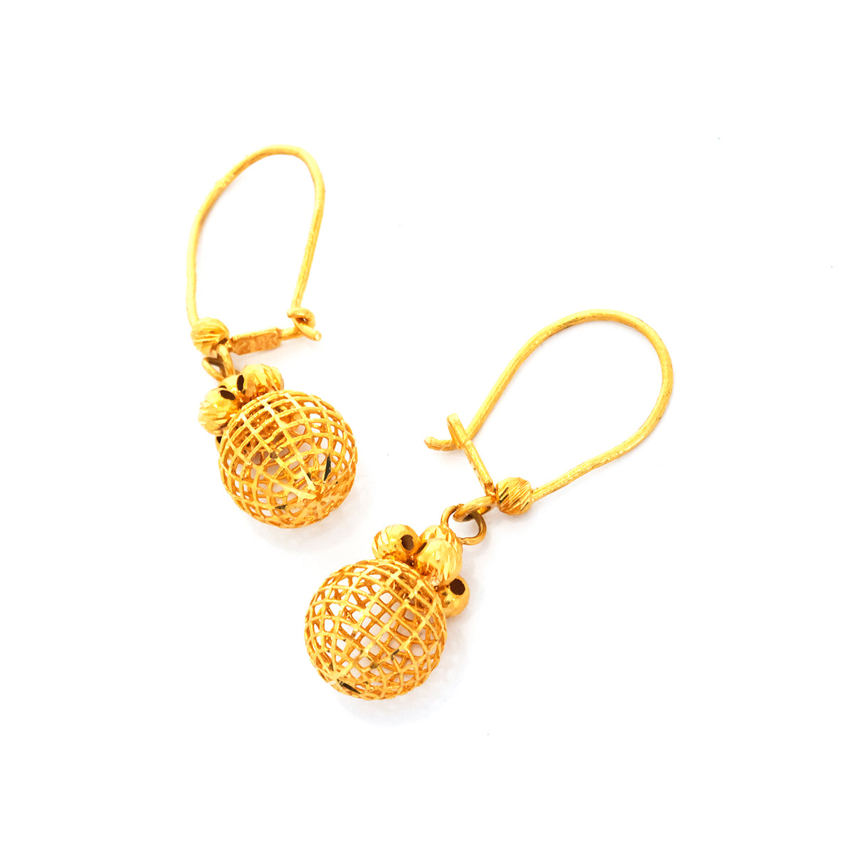 Gold pineapple earrings on a white background