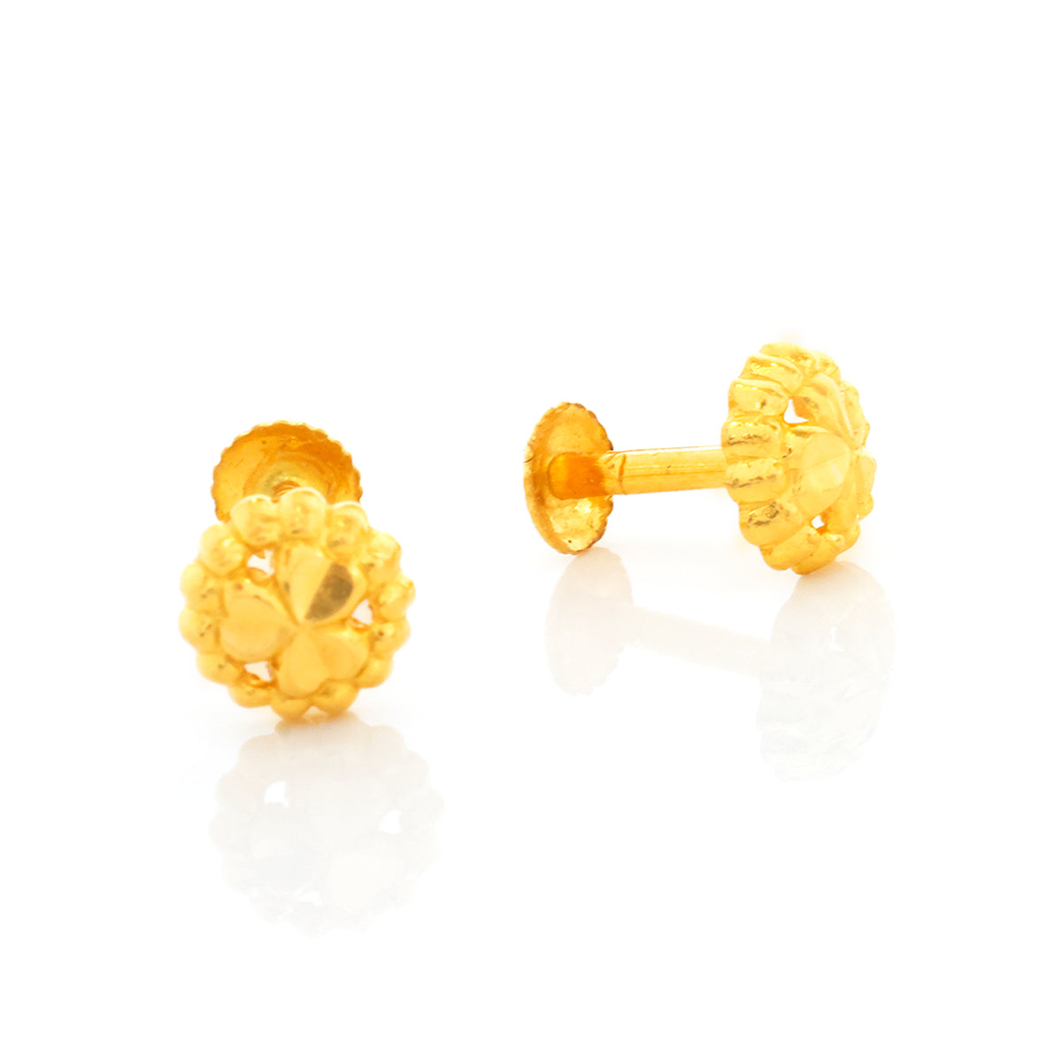 Pair of gold earrings on a white background