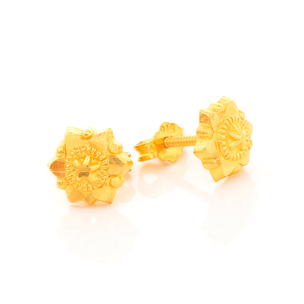 Pair of gold earrings on a white background