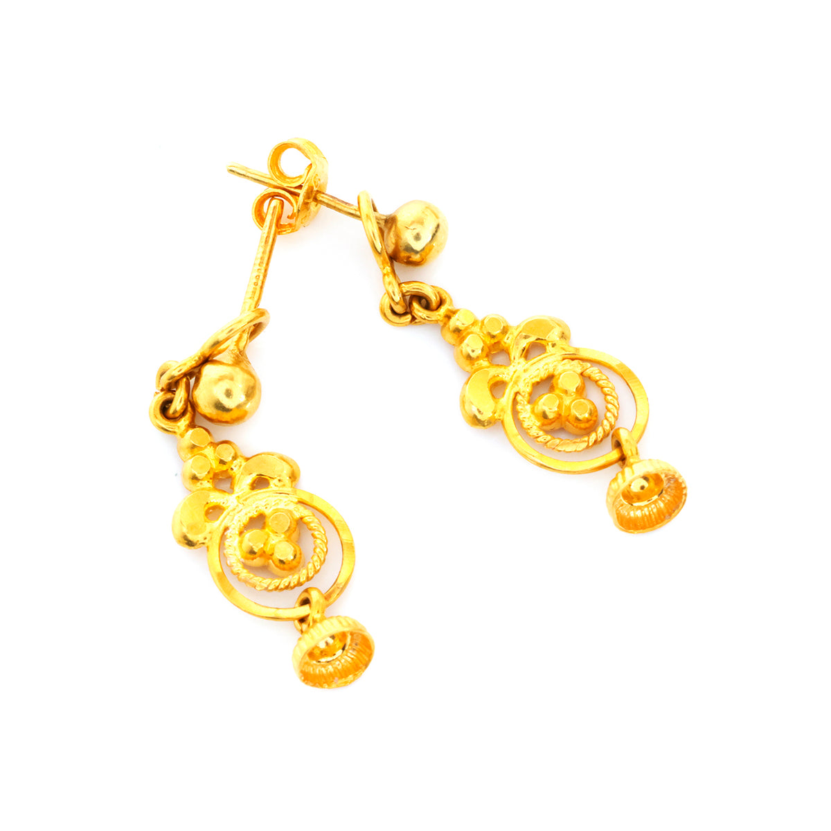 Gold earrings on a white background