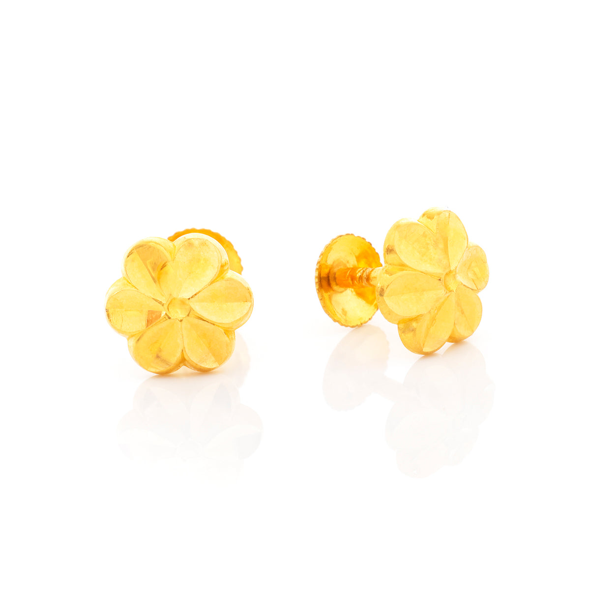 Pair of gold flower-shaped earrings on a white background