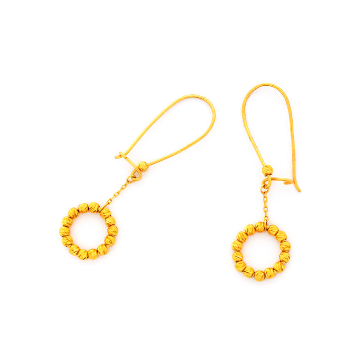 Pair of gold hoop earrings on a white background