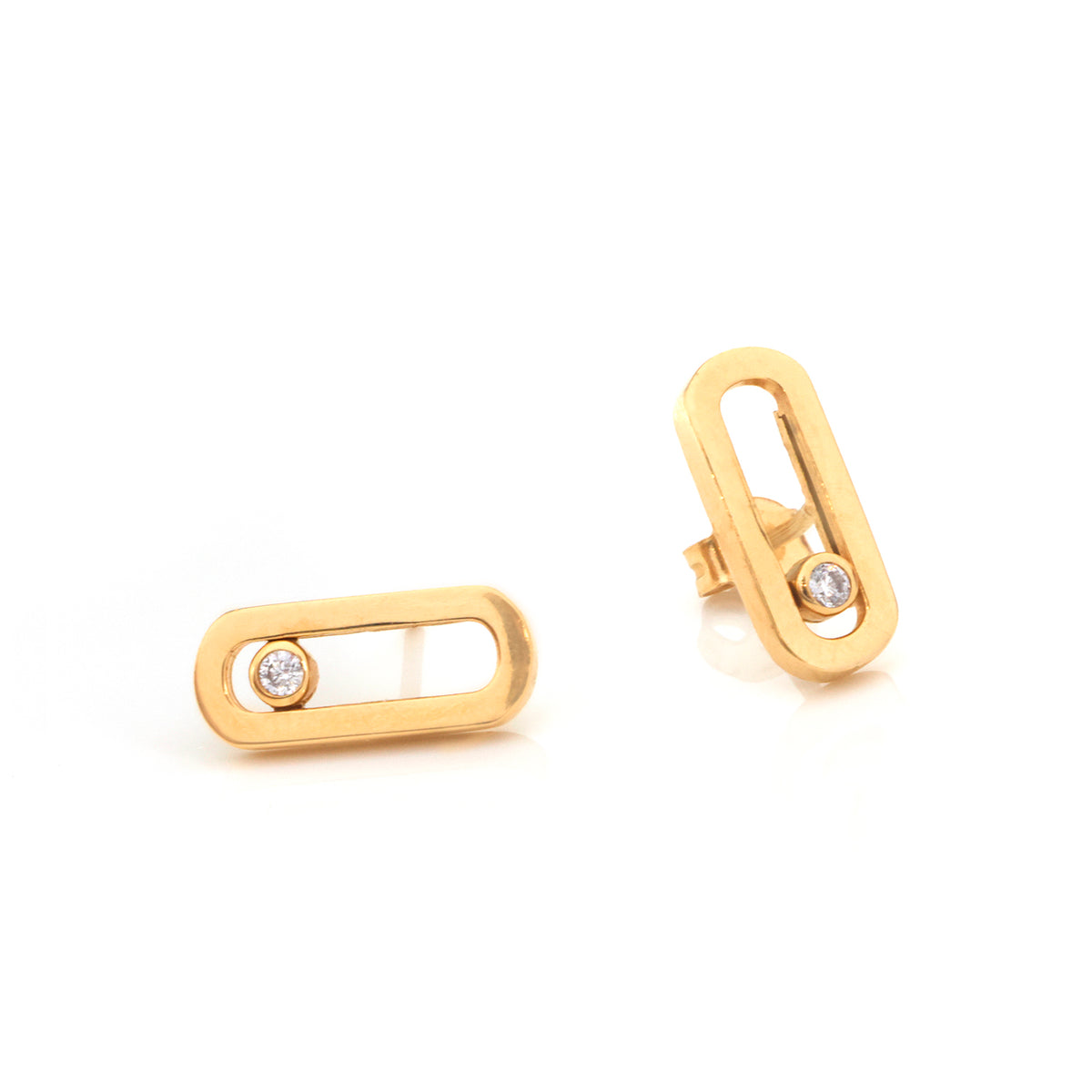 A pair of gold oval stud earrings with a small round clear gemstone set in the center, shown on a clean white background.