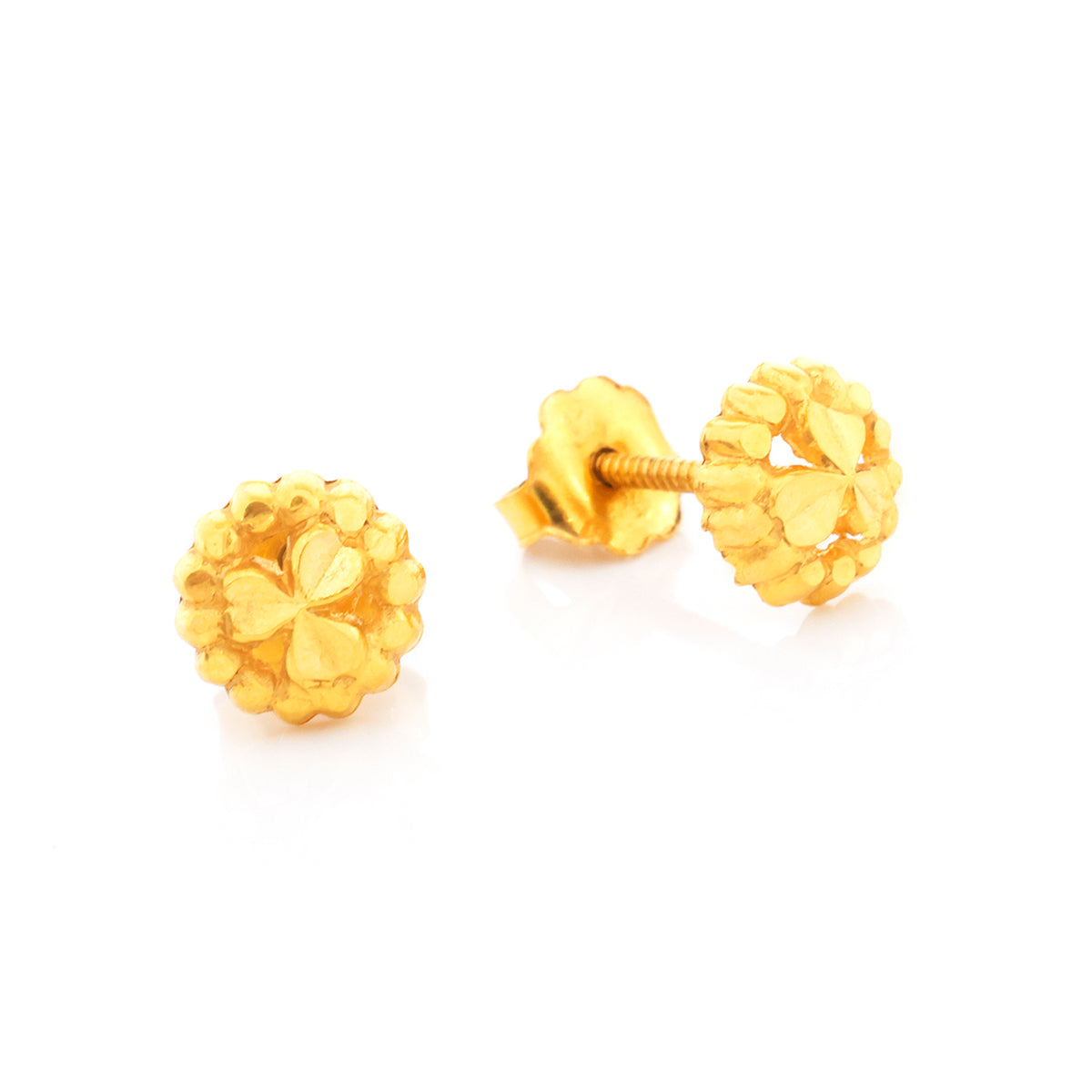 Pair of gold flower-shaped earrings on a white background