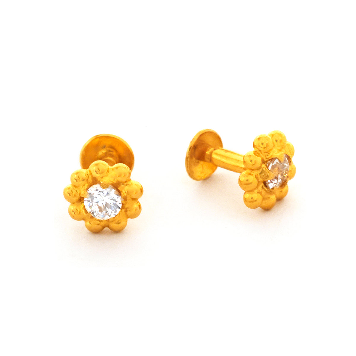 Pair of gold flower-shaped earrings with clear gemstones on a white background