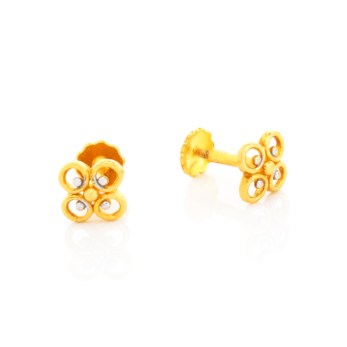 Pair of gold flower-shaped earrings on a white background