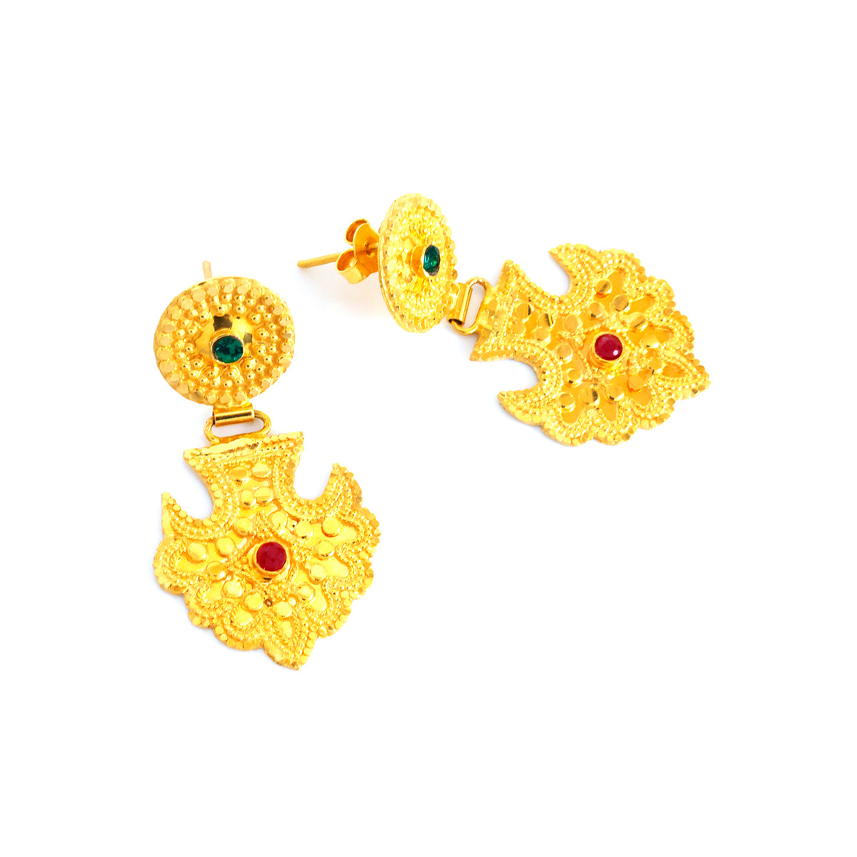 Gold earrings with intricate designs and red and green gemstones on a white background