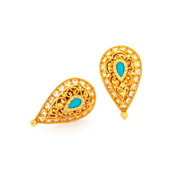 Gold earrings with turquoise stones on a white background