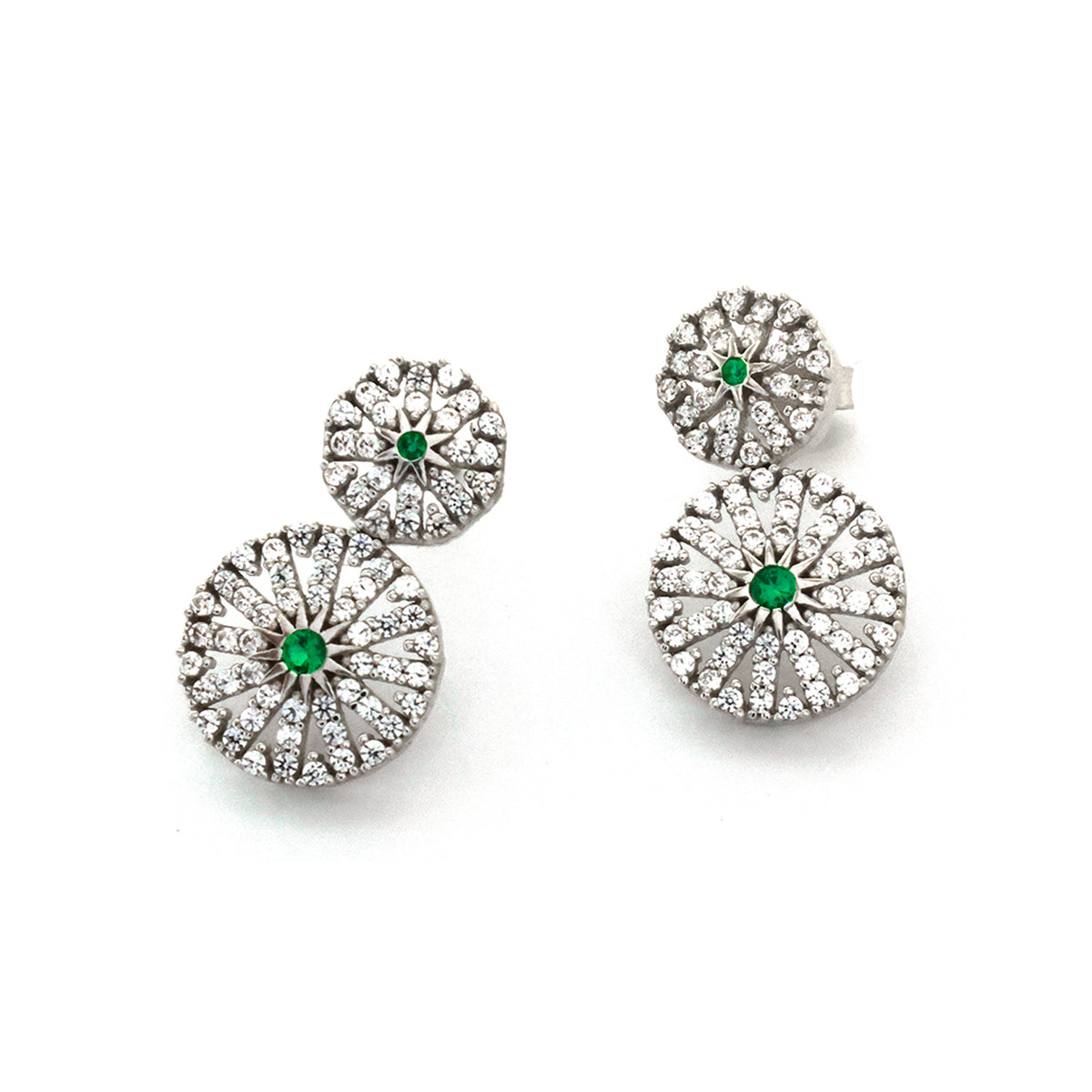Set of silver earrings with green gemstones on a white background