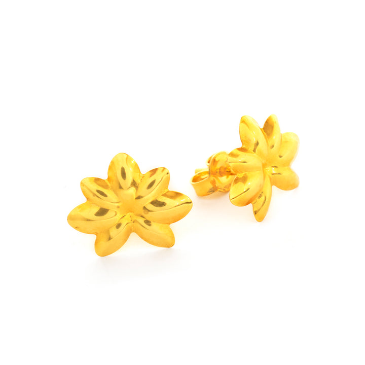Gold flower-shaped earrings on a white background