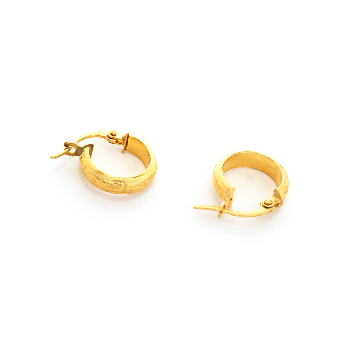 Gold hoop earrings on a white background