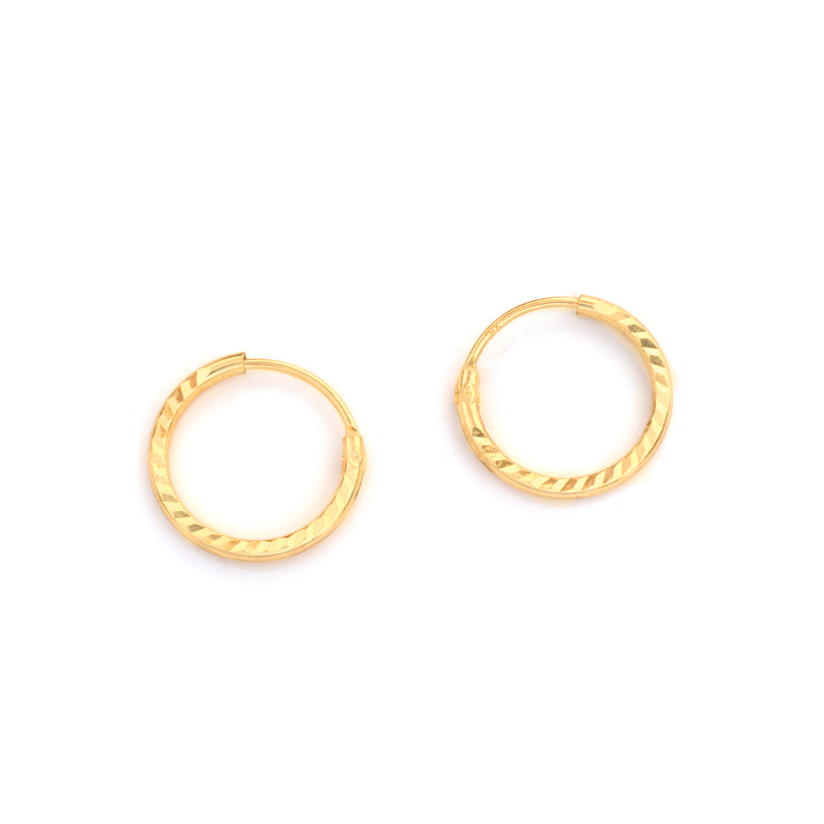 A pair of small gold hoop earrings with a textured, twisted outer edge, displayed on a clean white background.