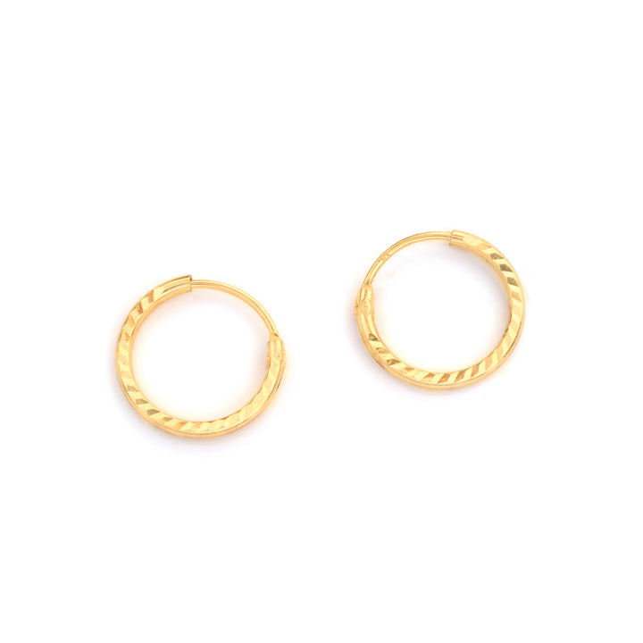 A pair of small gold hoop earrings with a textured, twisted outer edge, displayed on a clean white background.
