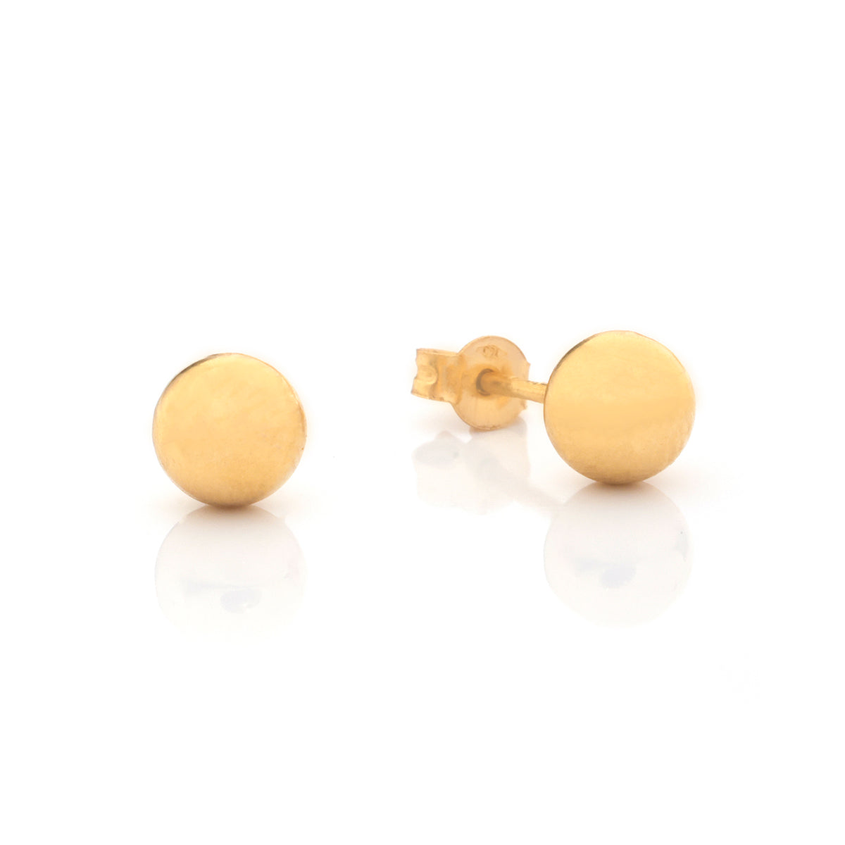 A pair of minimalist gold stud earrings with a matte finish, one shown from the front and the other from the side displaying the post and butterfly back, set against a clean white background with soft reflections.