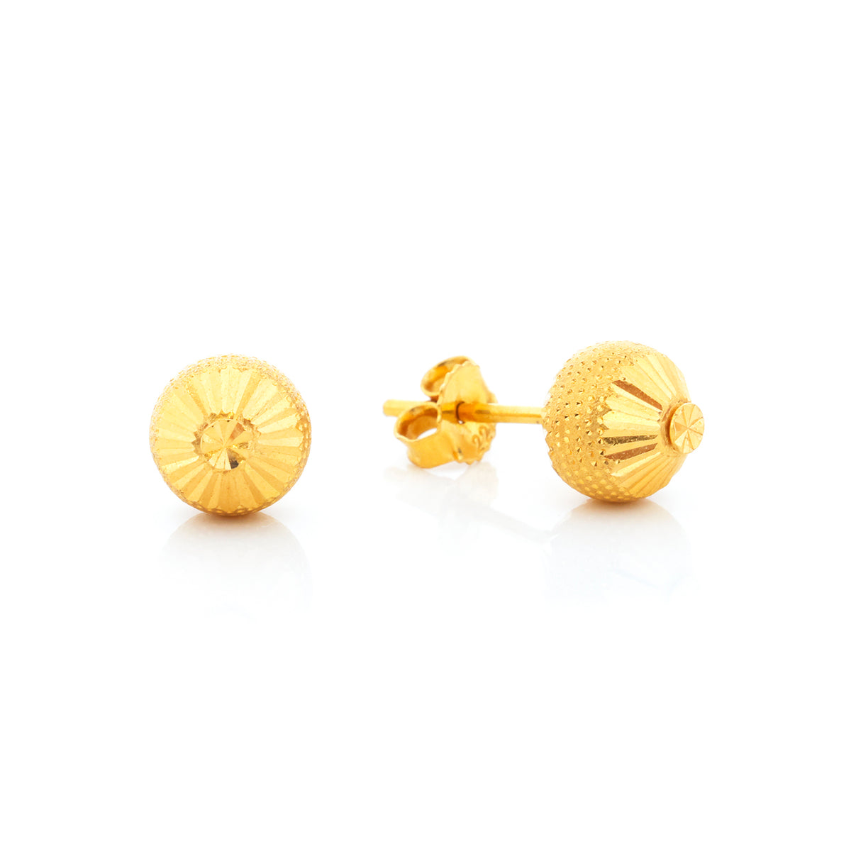 Pair of gold stud earrings on a white background