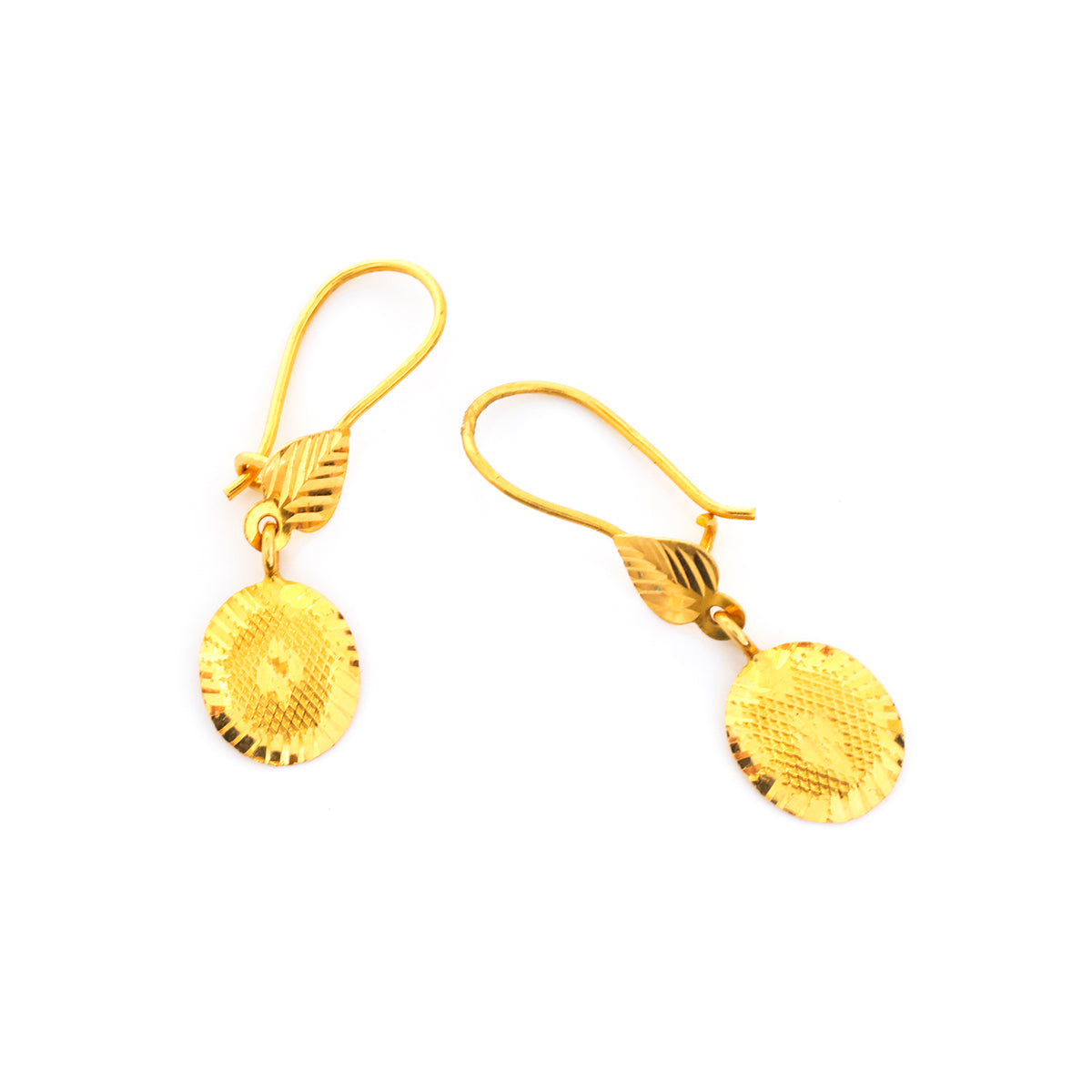 Pair of gold earrings on a white background
