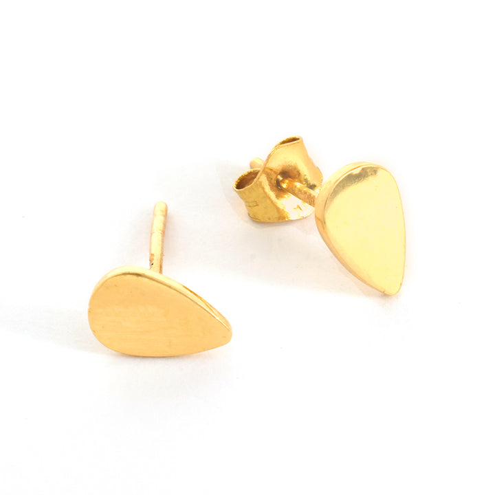 Gold teardrop-shaped earrings on a white background