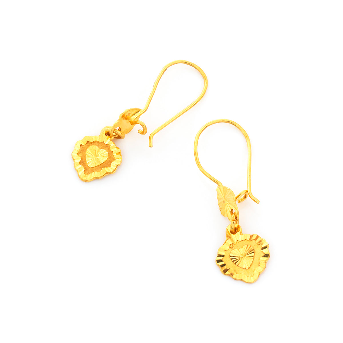 Pair of gold earrings on a white background